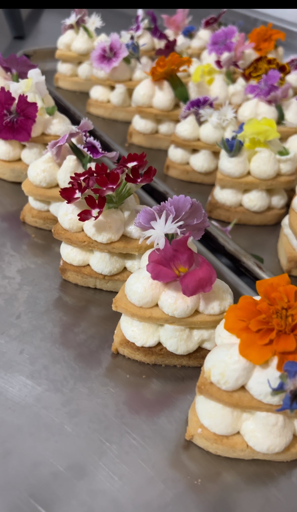 Cream biscuits with edible flowers