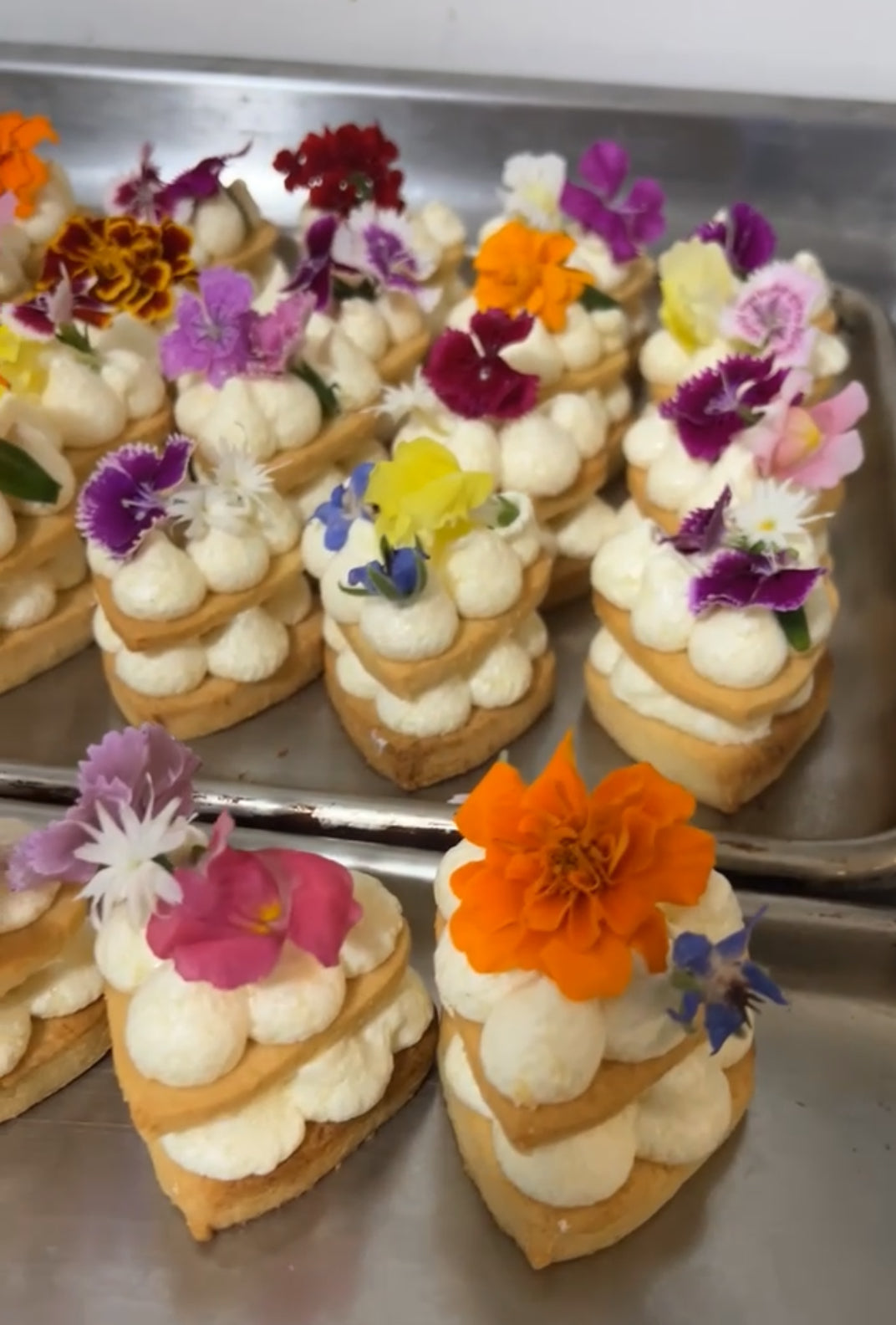 Cream biscuits with edible flowers